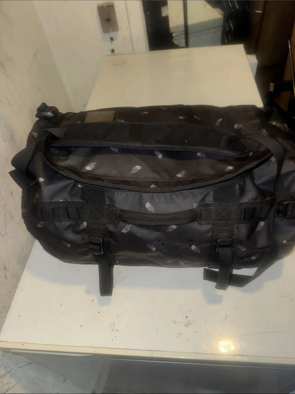 The North Face limited edition Black Duffel Messenger Bag with TNF logo repeat